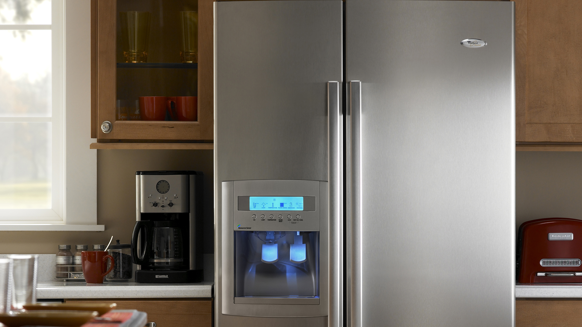A french door Whirlpool refrigerator with an ice maker